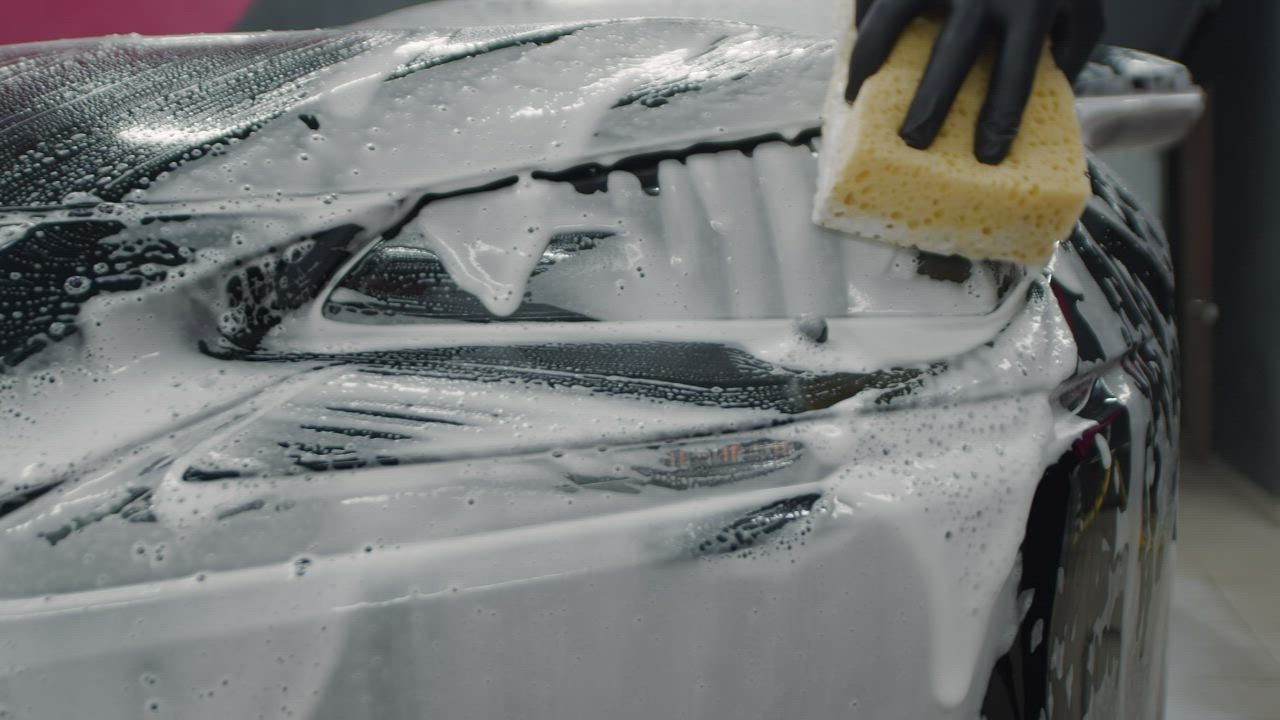 Man washing a soapy car down with a sponge - Clip Art Library