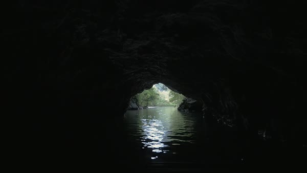 Slow motion clip of a boat sailing from dark islet D537_108_020 - Clip ...