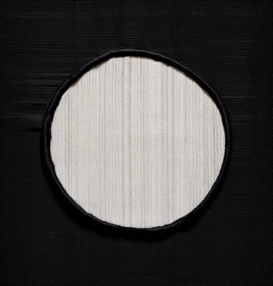 a cloth patch embroidered with a white circle an example of a circle with a white circle clip artwork, in the style of dark modernism, genderless, rectangular fields, fletcher sibthorp, ray collins, frank miller, gender-bending iconography