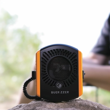 is a a tall by 4-inch wide personal portable fan and power bank. Imagine a dynamic and active scene. The Breeze EZ Portable Waist Clip Fan & Power Bank is being used by a hiker during a camping trip. The hiker is sitting on a log, taking a break from their journey. The fan is clipped to their belt, visibly providing a soothing breeze. The hiker's smartphone is connected to the fan, indicating the power bank feature. The scene is set in a lush forest with sunlight filtering through the trees. The