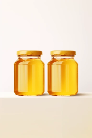 two identical glass jars with honey, vertical jars, on the white shelf, mockup clipart